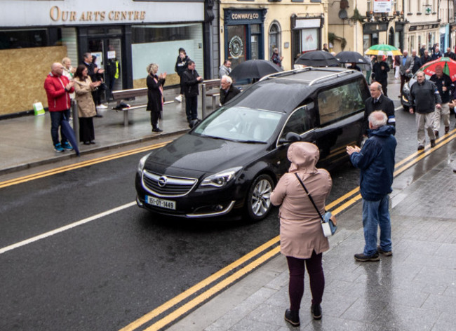 members-of-the-public-adhere-to-social-distancing-as-the-hearse-carrying-paddy-fenning-passes-by