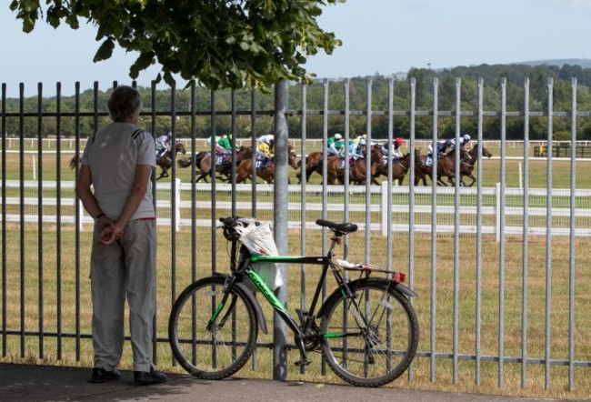 locals-watch-the-first-race-from-outside-naas-racecourse-as-racing-in-ireland-resumes