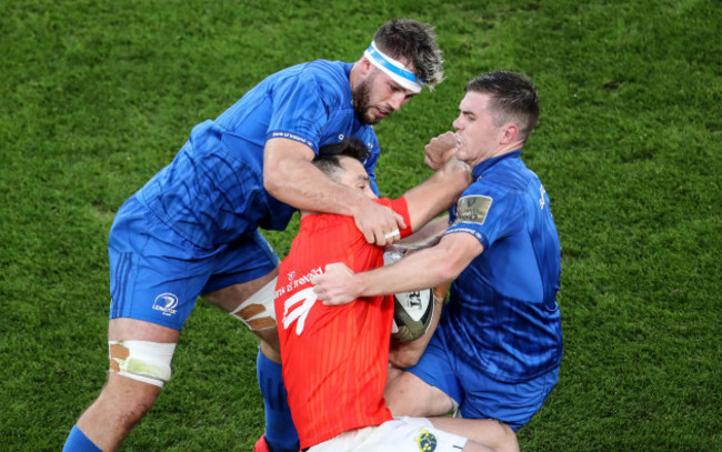 conor-murray-is-tackled-by-caelan-doris-and-luke-mcgrath