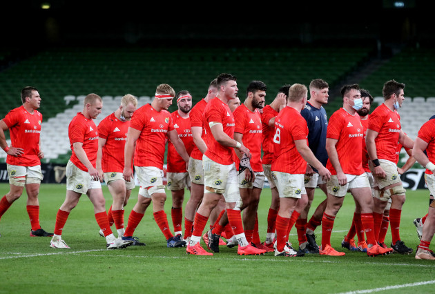 the-munster-team-leave-the-field-dejected