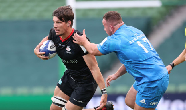 saracens-mike-rhodes-is-tackled-by-leinsters-ed-byrne
