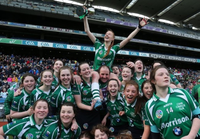 cahir-team-celebrate-with-player-of-the-game-aishling-moloney-lifted-shoulder-high