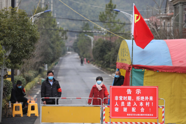 china-wuhan-coronavirus-emergency-volunteers-guard-a-visitor-checkpoint-at-the-entrance-to-a-village-in-hangzhou-in-east-chinas-zhejiang-province