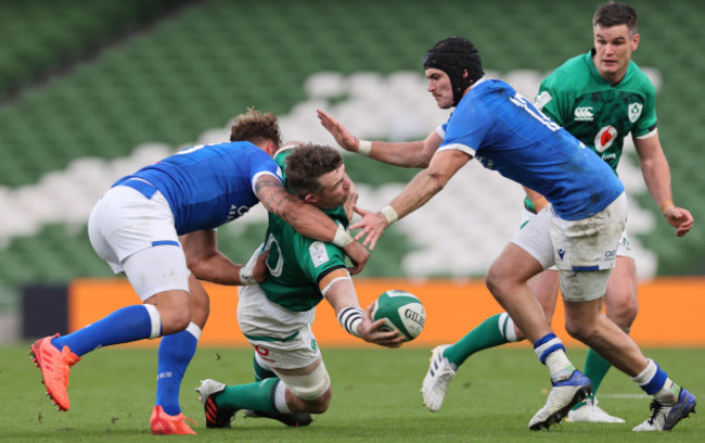 irelands-peter-omahony-is-tackled-by-italys-federico-mori-and-carlo-canna