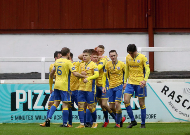 rob-manley-celebrates-scoring-a-goal-with-team-mates