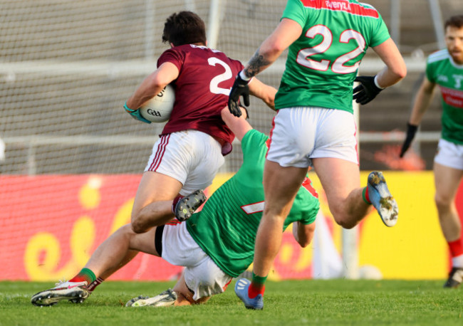 sean-kelly-is-tackled-by-eoghan-mclaughlin