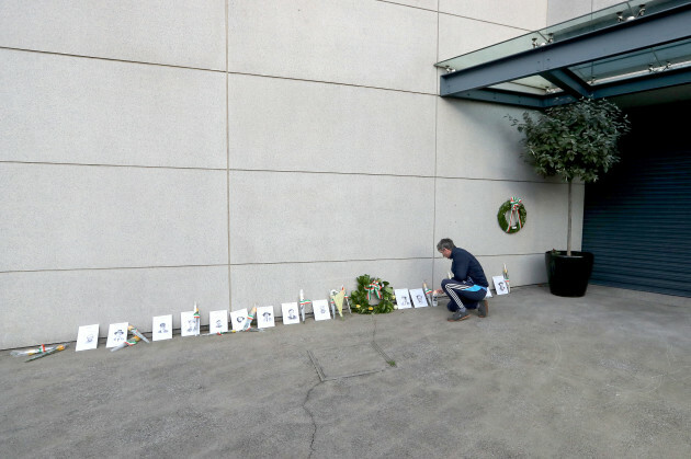 tom-broughan-lights-a-candle-outside-the-memorial-to-the-14-victims-of-bloody-sunday-on-jones-road-ahead-of-the-gaa-bloody-sunday-commemoration-at-croke-park