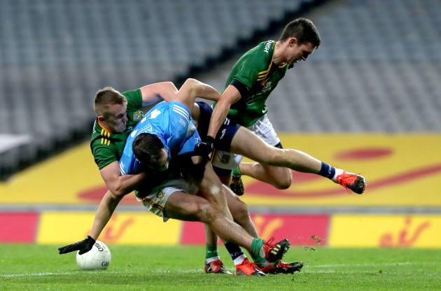 dean-rock-is-tackled-by-ronan-ryan-and-shane-mcentee