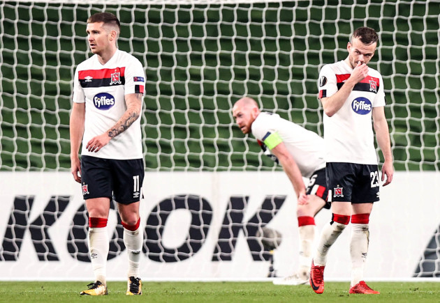 patrick-mceleney-cameron-dummigan-and-chris-shields-dejected-after-rapid-scored-their-third-goal