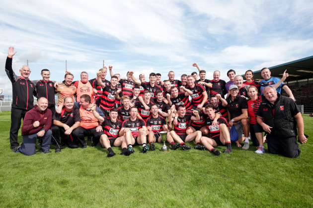 ballygunner-players-celebrate-with-the-trophy
