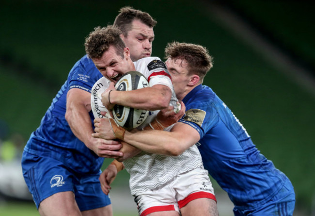 billy-burns-is-tackled-by-cian-healy-and-garry-ringrose