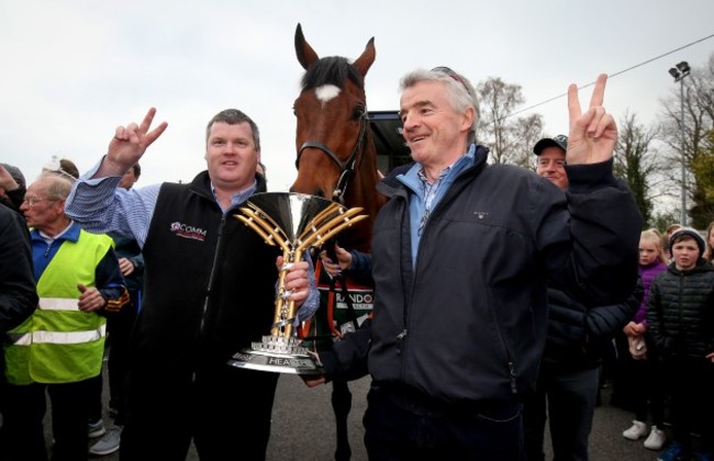 tiger-roll-is-led-through-the-village-of-summerhill-co-meath-by-trainer-gordon-elliott-and-owner-michael-oleary