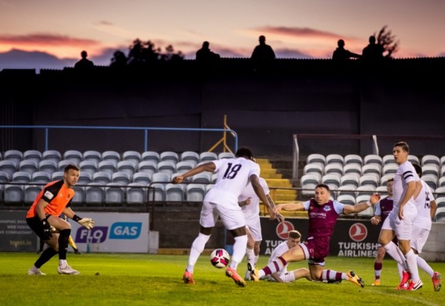 fans-watch-from-outside-the-fence-as-chris-lyons-has-a-shot-on-goal