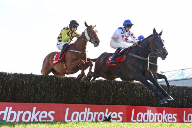 sam-twiston-davies-on-clan-des-obeaux-jumps-ahead-of-patrick-mullins-on-melon-during-the-race