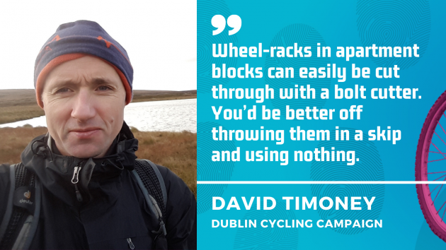 David Timoney - Wheel-racks in apartment blocks can easily be cut through with a bolt cutter. You’d be better off throwing them in a skip and using nothing.
