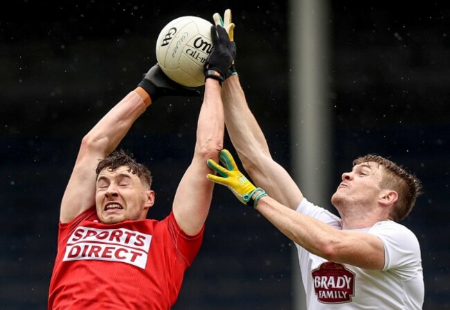 paul-walsh-competes-in-the-air-with-kevin-feely