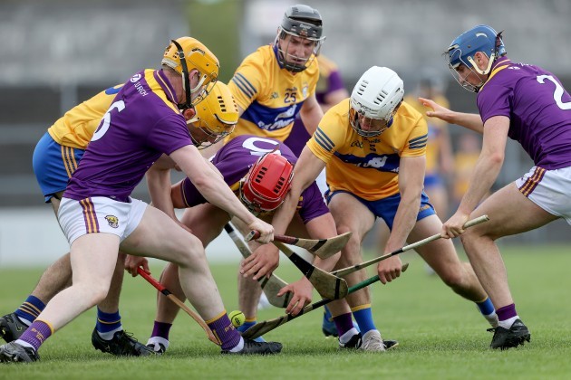 clare-and-wexford-players-contest-a-loose-ball