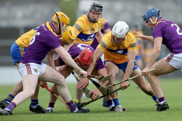 clare-and-wexford-players-contest-a-loose-ball