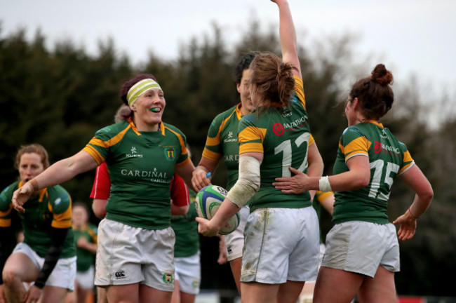 meg-kendal-celebrates-scoring-a-try-with-team-mates