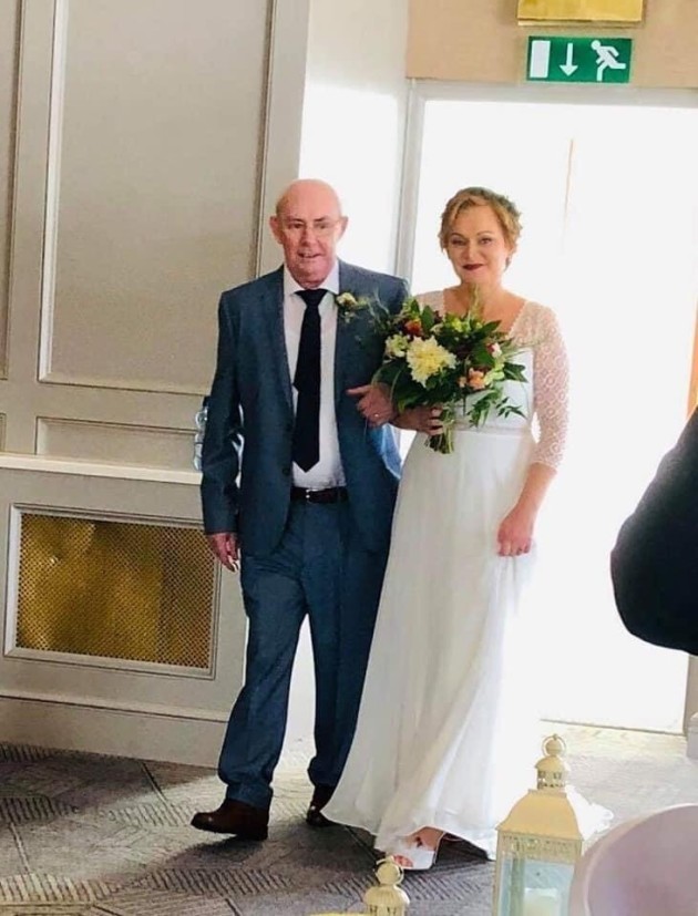 Catriona and John walking down the aisle