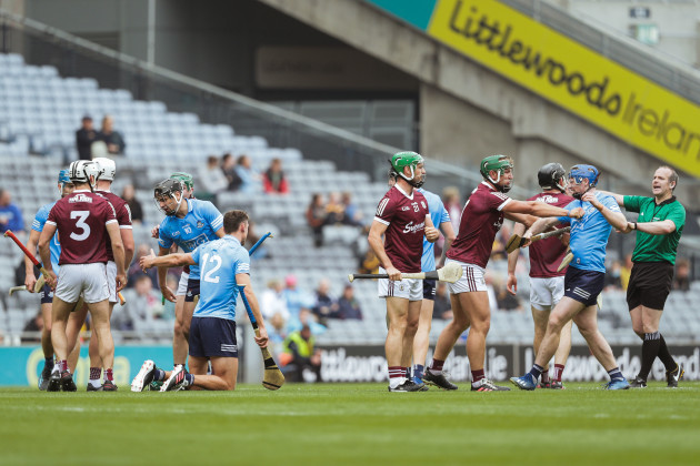 match-referee-johnny-murphy-tries-to-calm-tempers-during-an-altercation