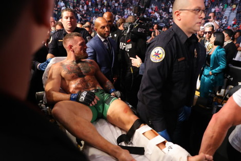 conor-mcgregor-leaves-the-cage-on-a-stretcher-after-injuring-his-ankle