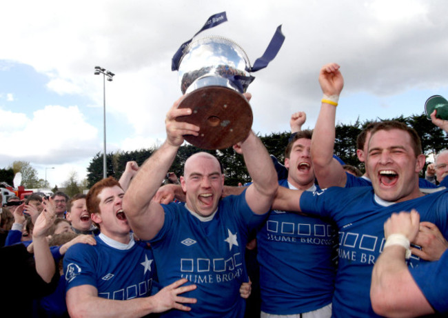 hugh-hogan-lifts-the-trophy