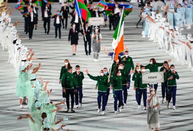 kellie-harrington-and-brendan-irvine-lead-team-ireland-while-holding-the-tricolour