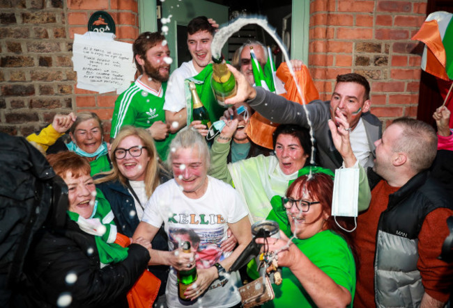 christopher-joel-christy-and-yvonne-harrington-celebrate-outside-their-family-home-in-portland-row