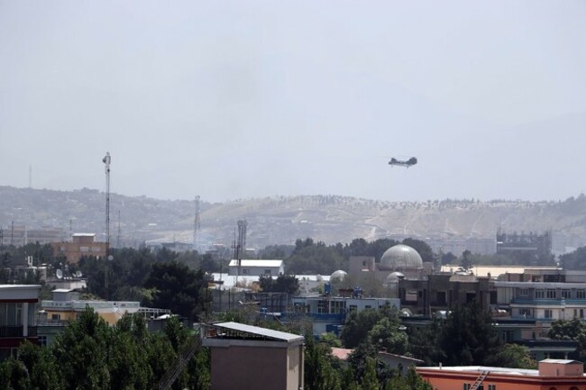 kabul-afghanistan-15th-aug-2021-sea-knight-military-transport-helicopter-flies-over-kabul-as-the-taliban-enter-kabul-afghanistan-on-sunday-on-august-15-2021-afghan-president-ashraf-ghani-repor