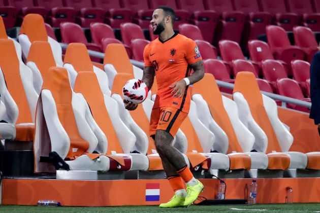amsterdam-netherlands-september-7-memphis-depay-of-the-netherlands-leaves-the-pitch-with-the-matchball-after-scoring-three-times-during-the-2022-fifa-world-cup-qualifier-match-between-netherlands