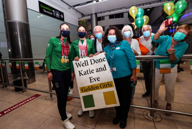 atie-george-dunlevy-and-eve-mccrystal-are-greeted-by-family-members