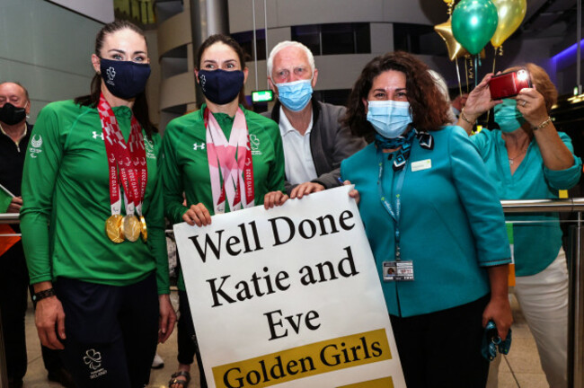 atie-george-dunlevy-and-eve-mccrystal-are-greeted-by-family-members