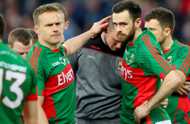 robert-hennelly-consoled-by-andy-moran-and-kevin-mcloughlin-after-the-game