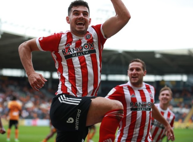 kingston-upon-hull-uk-18th-september-2021-john-egan-of-sheffield-utd-celebrates-scoring-the-second-goal-during-the-sky-bet-championship-match-at-the-kcom-stadium-kingston-upon-hull-picture-cred