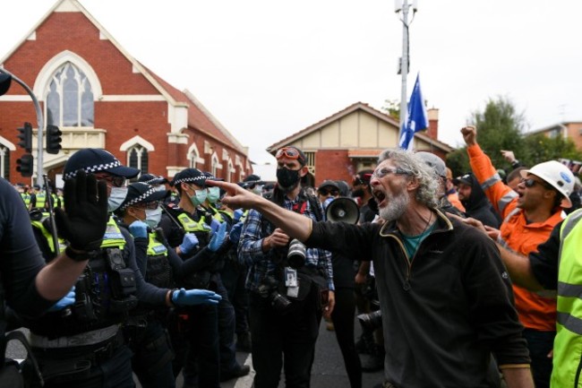 melbourne-australia-18-september-2021-protesters-shout-at-police-during-the-freedom-protest-on-september-18-2021-in-melbourne-australia-freedom-protests-are-part-of-an-international-co-ordinate