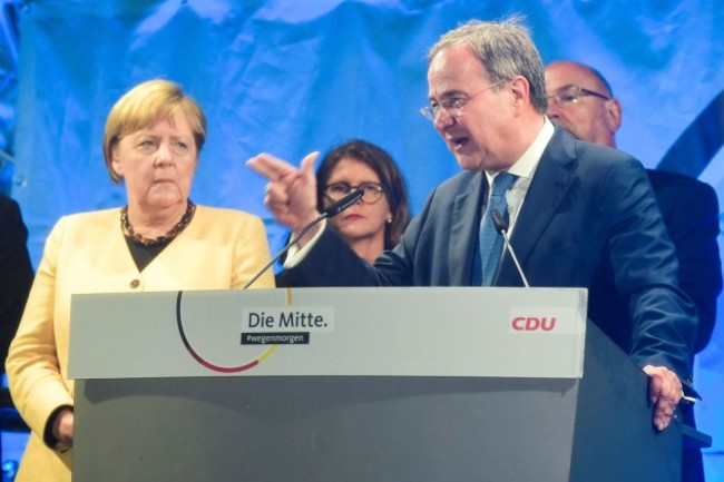 christian-democratic-union-cdu-leader-and-top-candidate-for-chancellor-armin-laschet-speaks-next-to-german-chancellor-angela-merkel-during-his-election-rally-in-stralsund-germany-september-21-2021