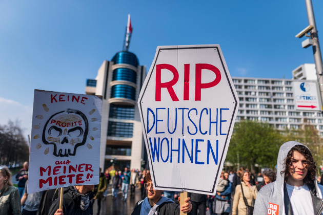 berlin-germany-14-april-2018-rip-deutsche-wohnen-is-written-on-a-sign-of-a-demonstrant-during-the-demonstration-under-the-motto-resist-rental-madness-in-front-of-the-spd-party-central-more-tha