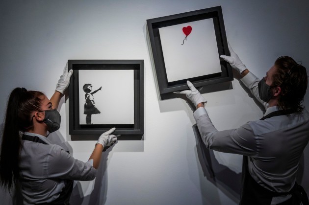 embargoed-till-10-30-01-oct-2021london-uk-1st-oct-2021-banksy-girl-and-balloon-diptych-2005-est-2-5-3-5m-at-christies-king-street-london-it-is-part-of-the-2021st-century-evening-sale-on