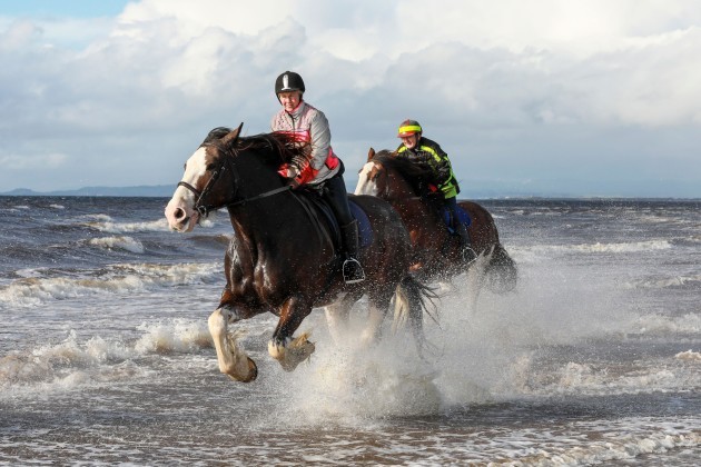 ayr-uk-03rd-oct-2021-hayley-whitepink-jacket-and-her-friend-linda-blackyellow-jacket-exercise-clyde-a-10-year-old-clydesdale-gelding-and-honey-8-year-old-clydesdale-mare-along-ayr-beach-a