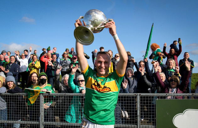 paul-shiels-celebrates-with-the-cup-in-front-of-dunloy-fans