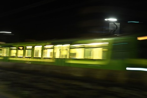 the-electric-rail-dart-dublin-area-rapid-transit-train-drives-past-dun-laoghaire-harbour-at-night-amid-the-coronavirus-disease-covid-19-pandemic-in-dublin-ireland-april-3-2021-picture-taken