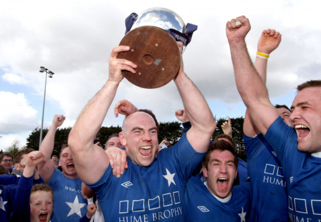 hugh-hogan-lifts-the-trophy