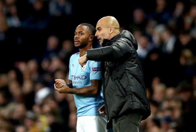 manchester-city-manager-pep-guardiola-right-speaks-with-player-raheem-sterling