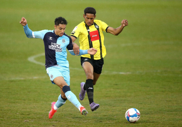 harrogate-towns-william-hondermarck-right-and-cambridge-uniteds-kyle-knoyle-left-battle-for-the-ball-during-the-sky-bet-league-two-match-at-the-envirovent-stadium-harrogate-picture-date-frida