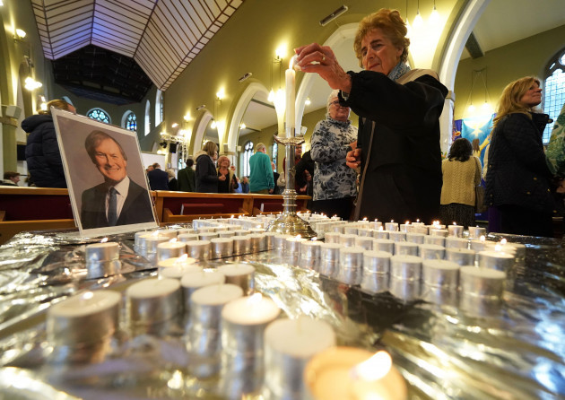 people-light-candles-during-a-vigil-at-st-michael-all-angels-church-in-leigh-on-sea-in-essex-for-conservative-mp-sir-david-amess-who-died-after-he-was-stabbed-several-times-at-a-constituency-surgery