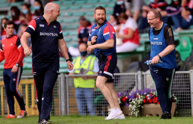 ronan-mccarthy-coach-cian-oneill-and-manager-billy-lee-share-a-joke-before-the-game