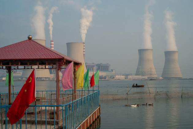 china-flag-decorating-a-pavilion-is-seen-in-front-of-a-power-plant-in-tianjin-china-19-oct-2021
