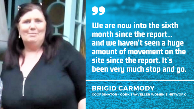 Brigid Carmody - coordinator of Cork Traveller Women's Network - wearing a black top - with quote - We are now into the sixth month since the report… and we haven’t seen a huge amount of movement on the site since the report. It’s been very much stop and go.