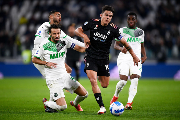 turin-italy-27-october-2021-paulo-dybala-of-juventus-fc-is-challenged-by-gregoire-defrel-gian-marco-ferrari-and-hamed-traore-of-us-sassuolo-during-the-serie-a-football-match-between-juventus-fc-an